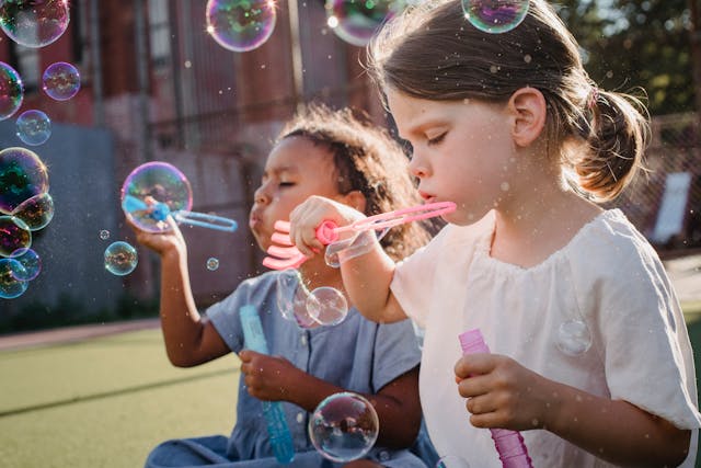 kids blowing bubbles